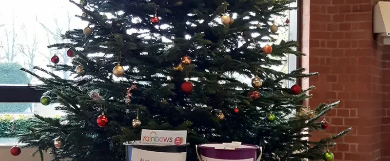 Christmas tress with charity collection buckets